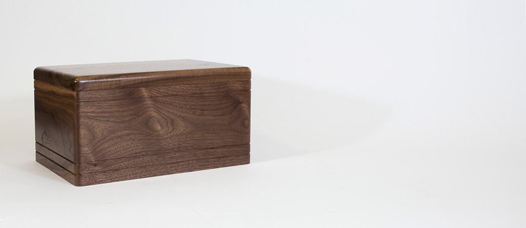 Boxwood companion urn in walnut wood