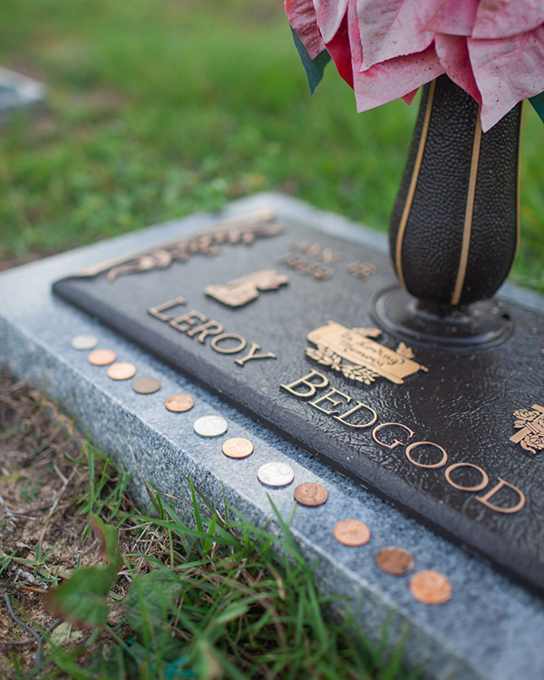 Leaving Coins at the Cemetery