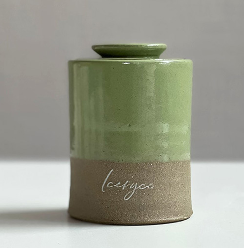 Small green pet urn